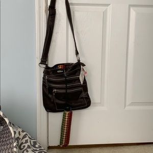 This is a brown crossbody bag with an umbrella !!